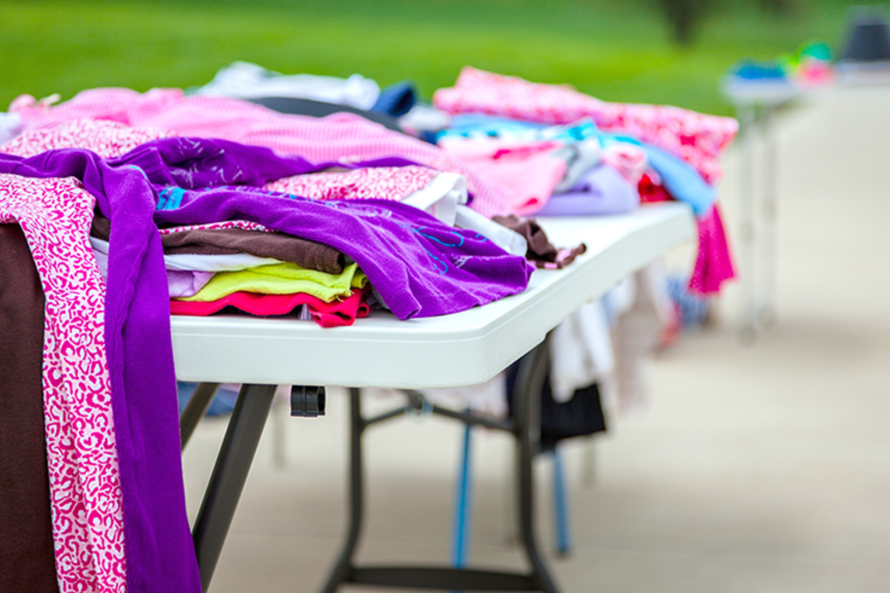 Various styles and colors of clothing were showcased during a garage sale